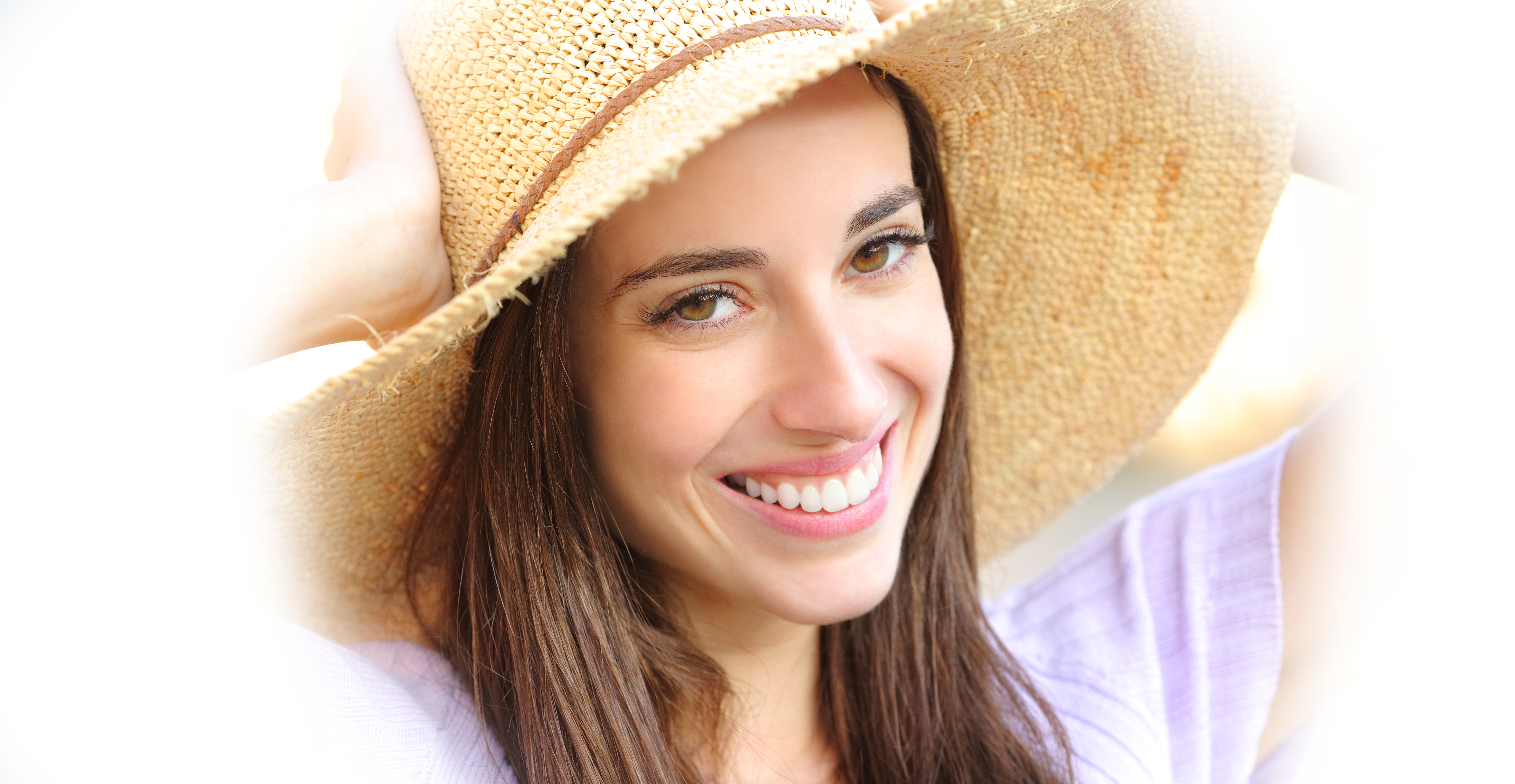 Woman smiling brightly after finishing Zoom teeth whitening at Orangeville Smiles Dentistry.